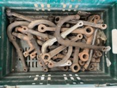 A crate of Alvis drop arms, steering parts etc.