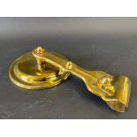 A polished brass windscreen pillar mounted exterior rear view mirror, probably American.