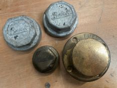 A large brass fuel filter cap, two aluminium Buick hub caps and another for Studebaker.