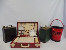A Shell Motor Spirit two gallon petrol can, a second for Esso, a fire blanket and a Brexton picnic