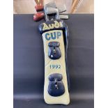 A decorative wall mounted 3D bag of golf clubs advertising Audi Cup 1992, 48" high.