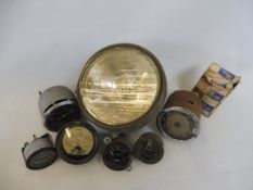A Raydyot spotlamp, a Veglia Italian 0-90mph speedometer, a black faced 0-80mph speedometer and