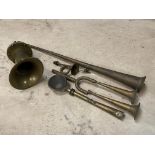 A brass electric horn and various horn parts.