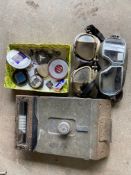 A military issue periscope, two pairs of goggles and various Lancia badges.