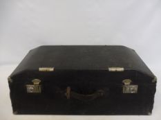 A sloping fronted and backed Brexton car trunk.