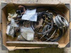 A box of mixed Lagonda parts including shackle pins, spring pins, linkage parts, brake cables, alloy