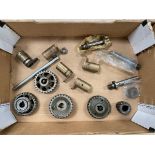 A box of inlet and exhaust timing gears and oil pump eccentrics including a set that have been
