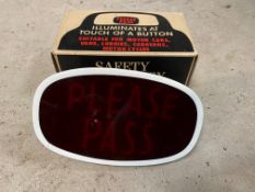 A new old stock 'Please Pass' illuminated rear window sign with original box, fittings and