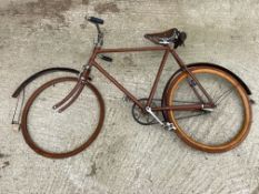 A Reliance British Made Birmingham gent's bicycle with leather saddle and wooden rim, lacking one