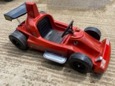 A fairground model of a Ferrari single seater F1 car.