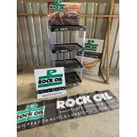 A Rock Oil four tier oil bottle stand, a Rock Oil banner and two signs.