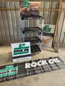 A Rock Oil four tier oil bottle stand, a Rock Oil banner and two signs.