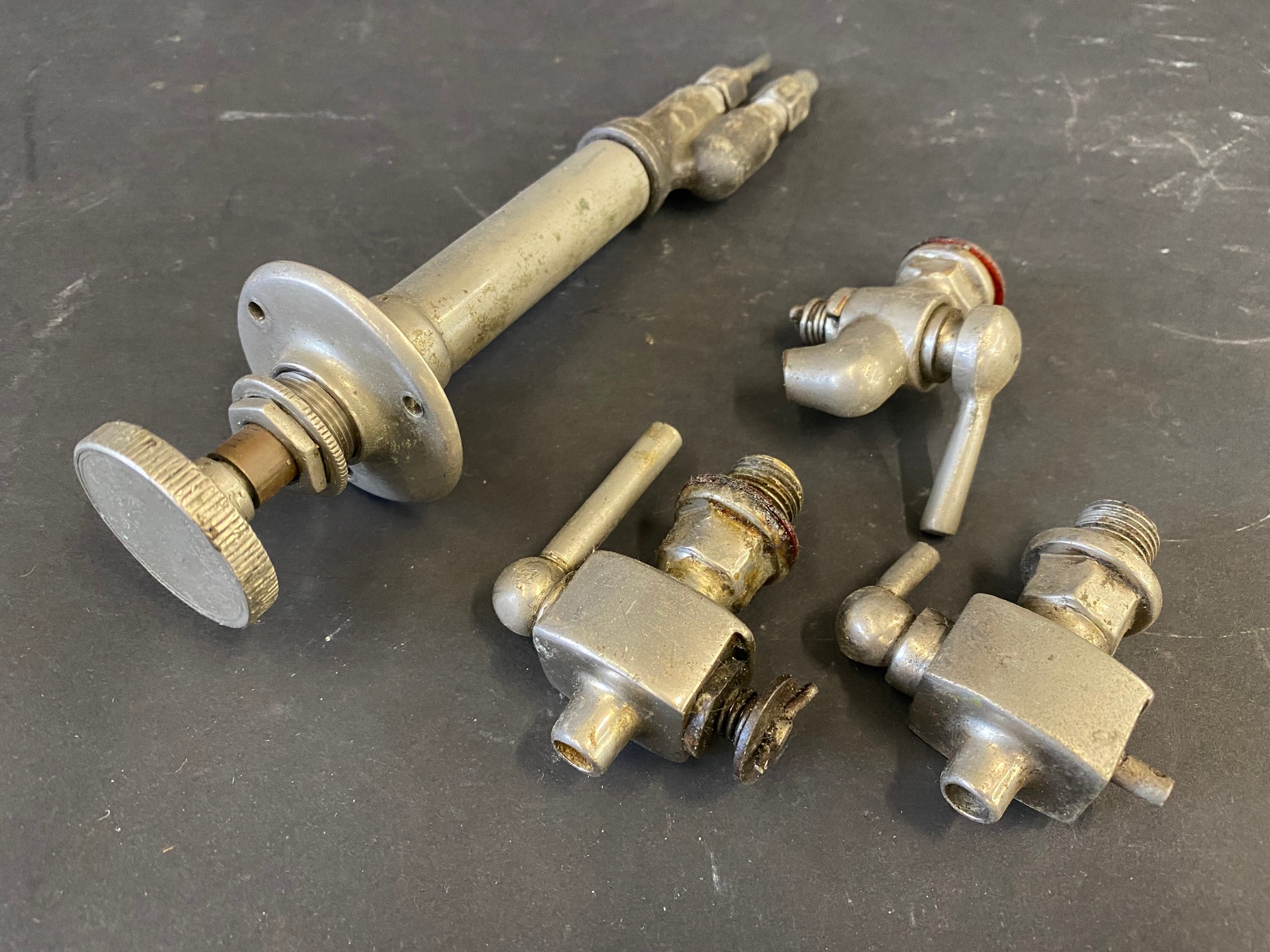 A nickel plated Ki-gass dashboard fuel pressuriser plus three block drain taps.