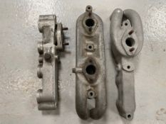 Three Riley single carburettor inlet manifolds, two appear to be for SU carbs, the third possibly