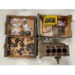 A Riley 9 cylinder block and three boxes of assorted mechanical parts and accessories including rear