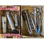 A small box of ratchets plus various box spanners.