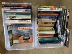 Two boxes of assorted motoring books.