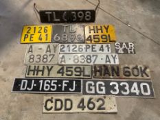 A collection of assorted number plates.
