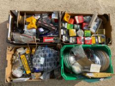 An autojumbler's lot in four boxes of car spares including new old stock, some relating to various