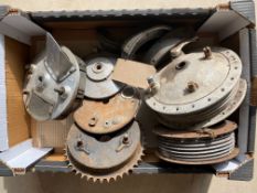 A box of hubs and Norton brake plates including a Norton front racing brake plate.