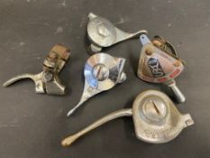 A tray of vintage motorcycle levers.