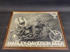 A framed and glazed print depicting a lady sat on a Harley Davidson, titled 'Harley-Davidson Beer