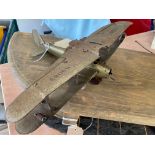 An early tinplate clockwork model of an aeroplane, incomplete.