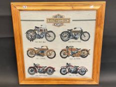 An embroidered picture showing the evolution of the Harley Davidson through six different models, 19