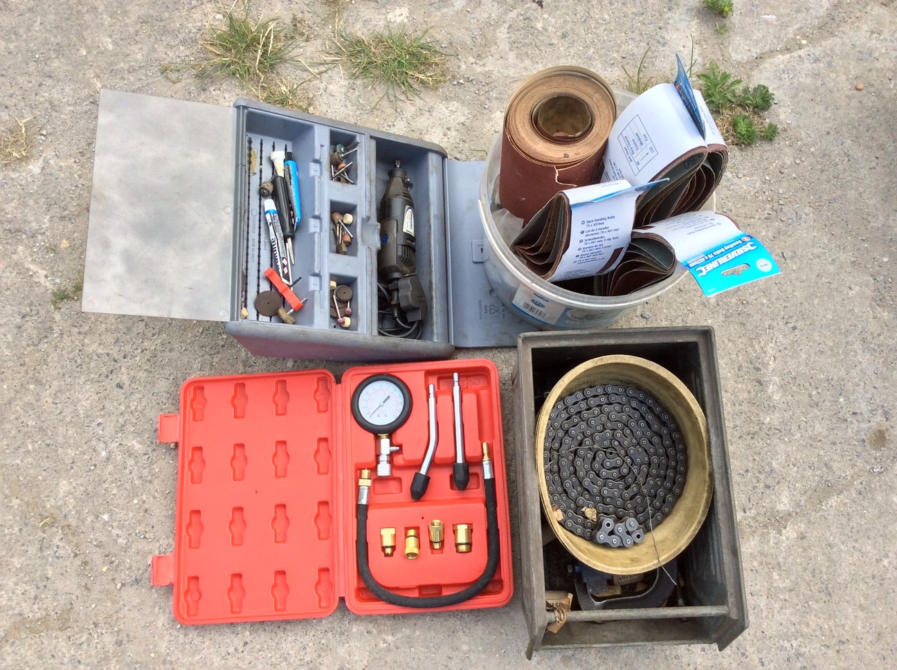 Various tools and ancillaries plus a motorcycle drive chain.