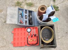 Various tools and ancillaries plus a motorcycle drive chain.