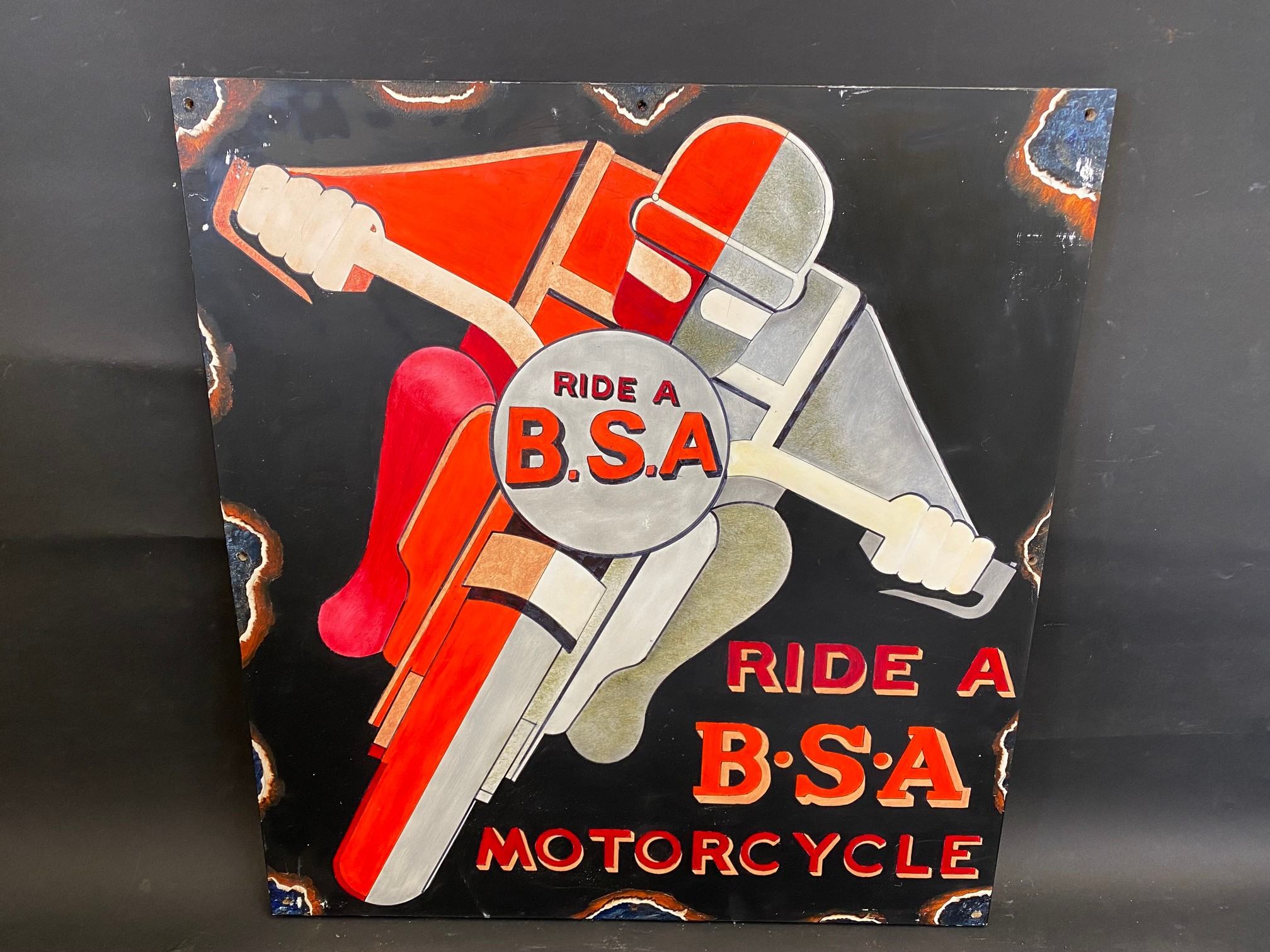 A decorative and contemporary oil on board depicting a motorcyclist riding a BSA, 21 3/4 x 23 3/4".