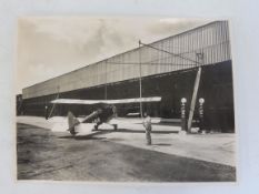 An interesting photograph of an Avro 621 Tutor, at Hamble Aerodrome, sat beside two Wayne 800 petrol
