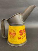 A Shell Motor Oil pint measure, dated 1948.