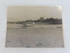 An early photograph of the Golden Hind, sat on water in harbour.