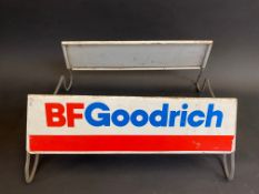 A B.F. Goodrich tyre display stand with advertising sign to both sides.