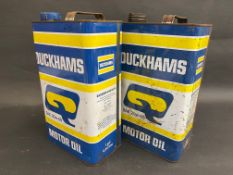 Two Duckhams gallon cans.
