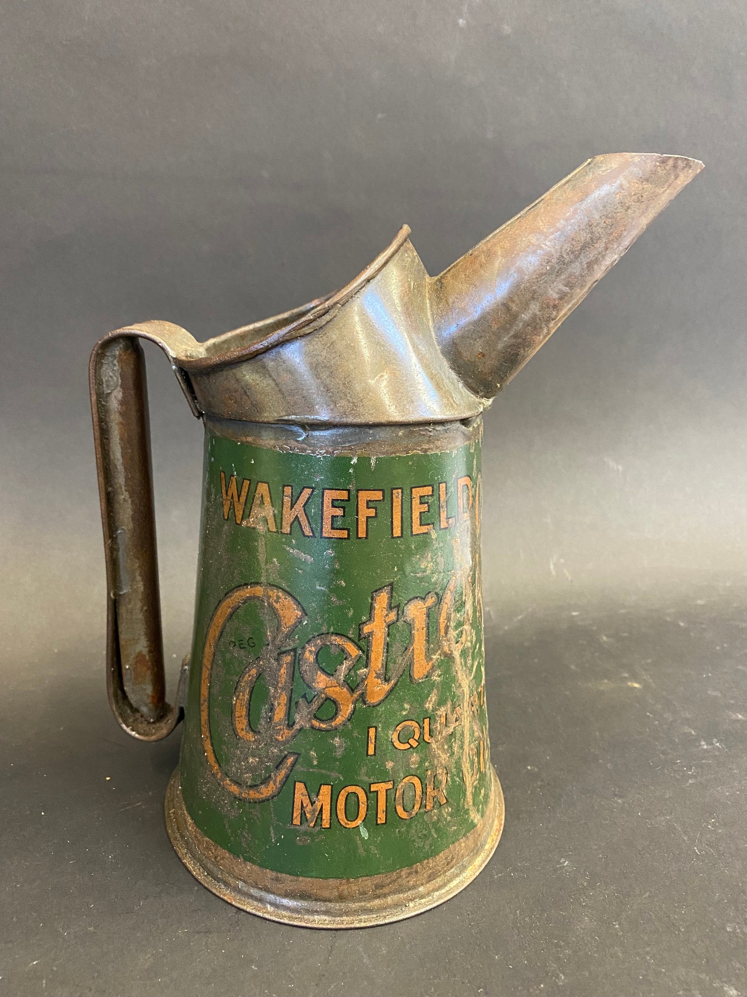 A Wakefield Castrol Motor Oil quart measure.