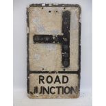 An aluminium road sign for Road Junction, with glass reflective discs (one missing), 12 x 21".