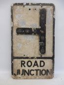 An aluminium road sign for Road Junction, with glass reflective discs (one missing), 12 x 21".