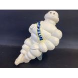 A Michelin air tower advertising plastic seated Mr. Bibendum figure.