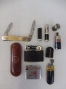 A selection of petrol/oil company related lighters including Mobil, Shell and Veedol plus a Shell