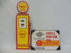 A contemporary tin Shell sign in the shape of a petrol pump, 10 x 32" plus a Shell Motor Oil branded