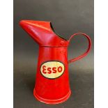 An Esso quart oil measure, in very good condition, dated 1955, tall version.