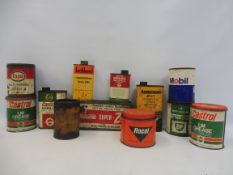 A quantity of assorted oil cans and grease tins.