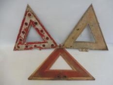 Three assorted aluminium triangular warning signs.