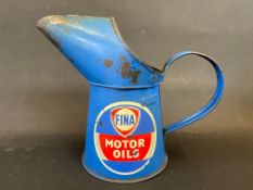 A Fina Motor Oils pint measure.