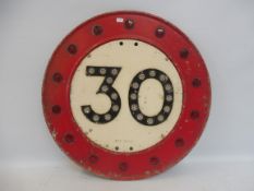 A 30 mph speed limit road sign by Gowshall Limited, with glass reflective discs, 18" diameter.