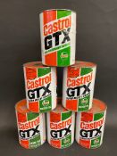 Six cans of Castrol GTX oil.