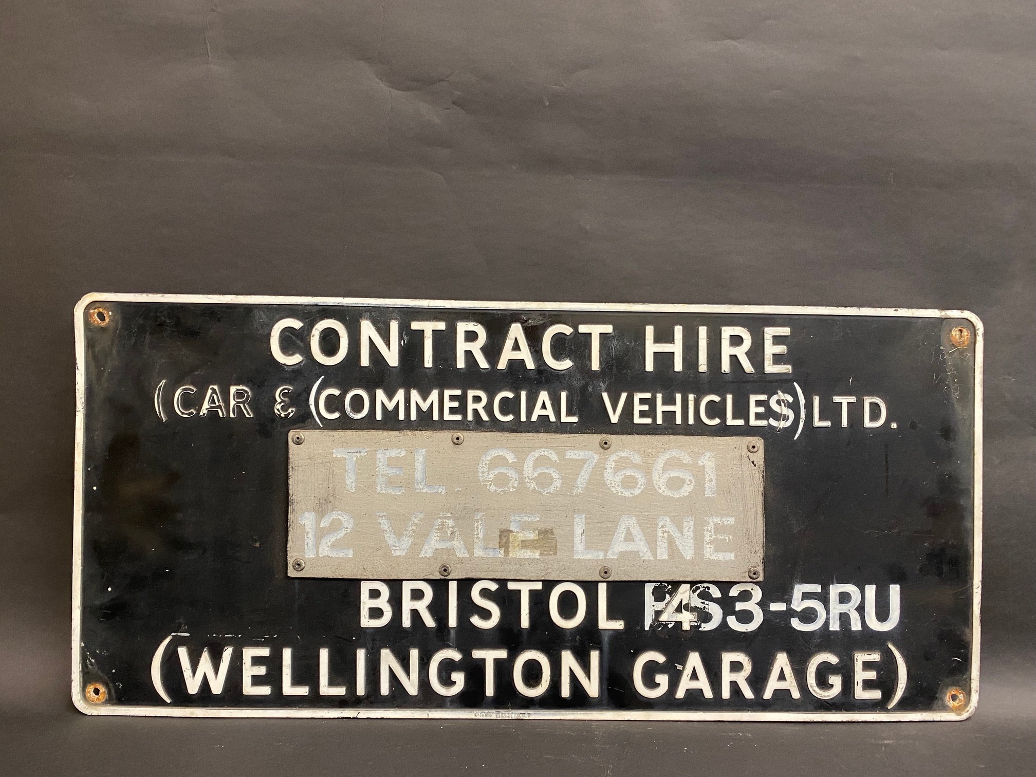A rectangular advertising sign for 'Contract Hire' at Wellington Garage, Bristol, 30 x 14".