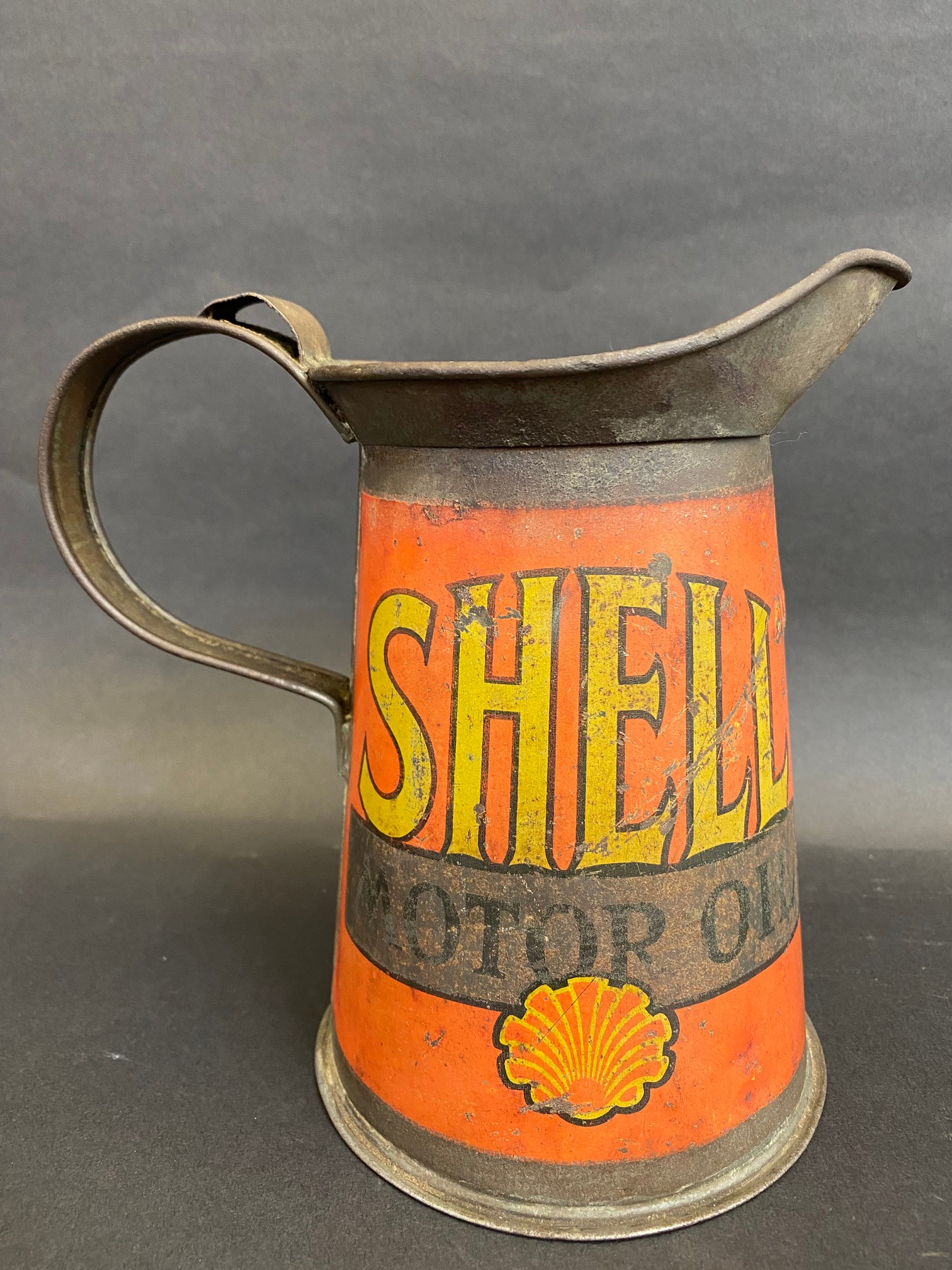 An early Shell Motor Oil wide neck quart measure.